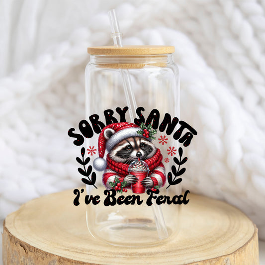 Sorry Santa I Have Been Feral Raccoon design on a 16 oz glass tumbler