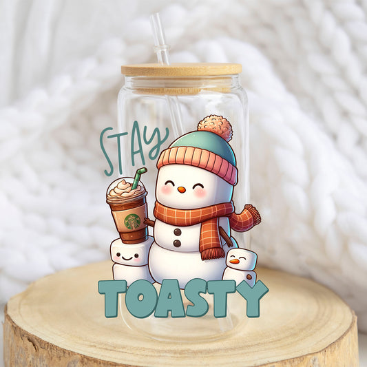 Stay Toasty Snowman design on a 16 oz glass tumbler
