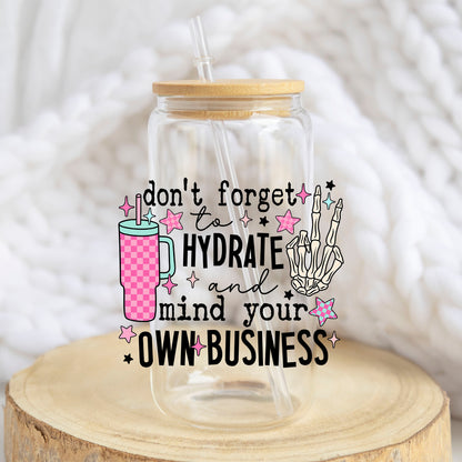 Hydrate and Mind Your Own Business design on a 16 oz glass tumbler