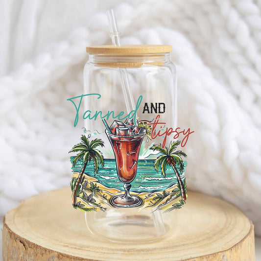 Tanned and Tipsy Tropical design on a 16 oz glass tumbler