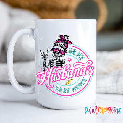 On My Husband's Last Nerve skeleton mug with pink and teal lettering, 15oz white ceramic