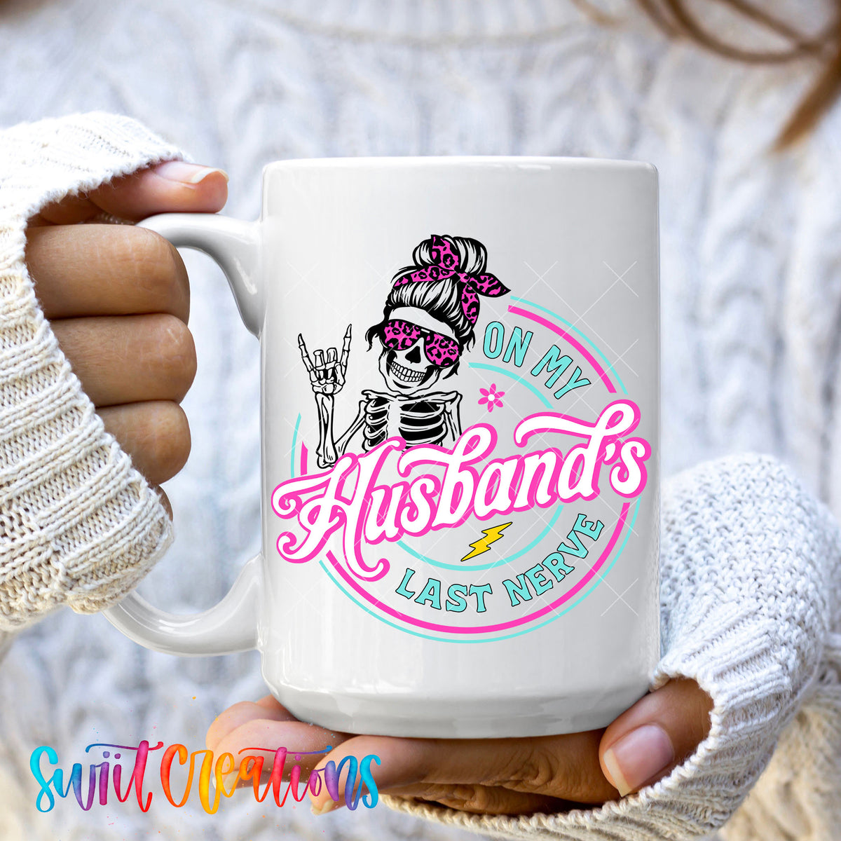 Hands holding the On My Husband's Last Nerve 15oz ceramic mug in a cozy sweater