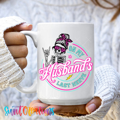 Hands holding the On My Husband's Last Nerve 15oz ceramic mug in a cozy sweater