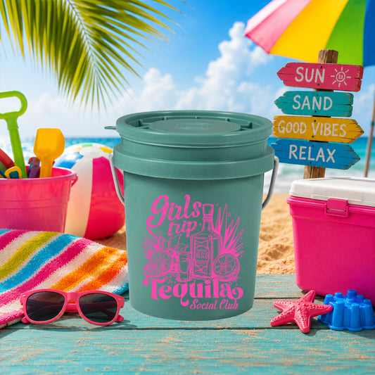 Girls Trip Tequila Social Club UV DTF transfer on a teal mini bucket on the beach