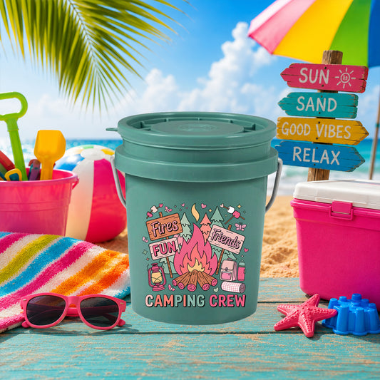 Camping Crew UV DTF transfer on a teal mini bucket on the beach
