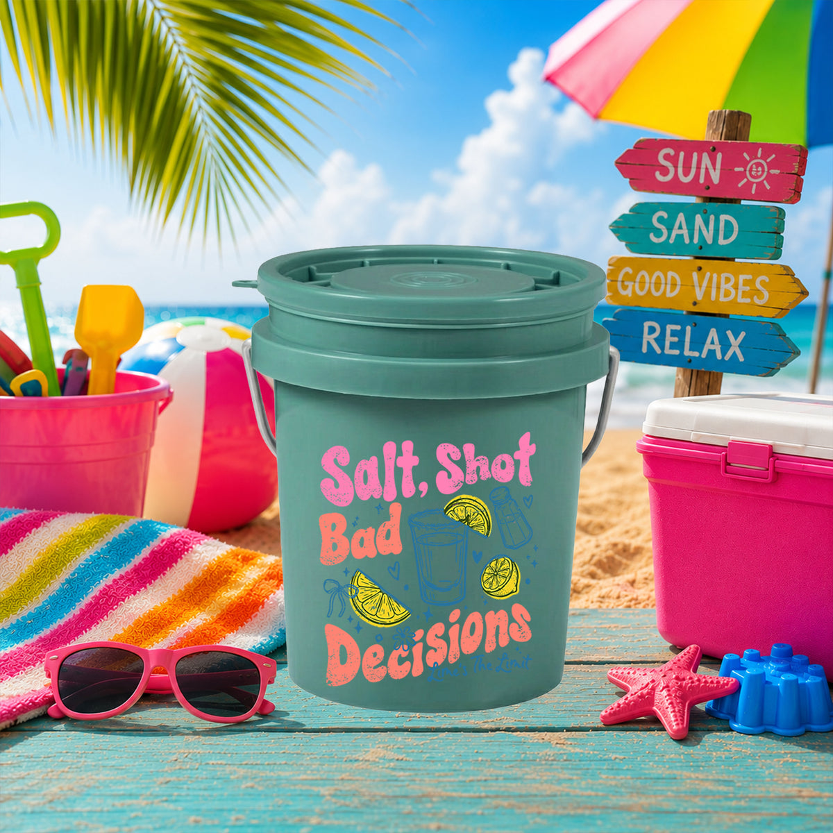 Salt Shot Bad Decisions UV DTF transfer on a teal mini bucket on the beach