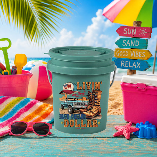 Livin' on That Blue Collar Dollar UV DTF transfer on a teal mini bucket on the beach