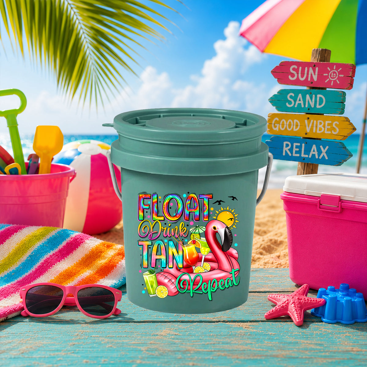 Float Drink Tan Repeat UV DTF transfer on a teal mini bucket on the beach