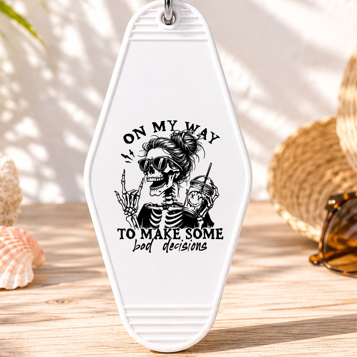 On My Way to Make Some Bad Decisions UV DTF transfer on a white motel keychain with beach decor