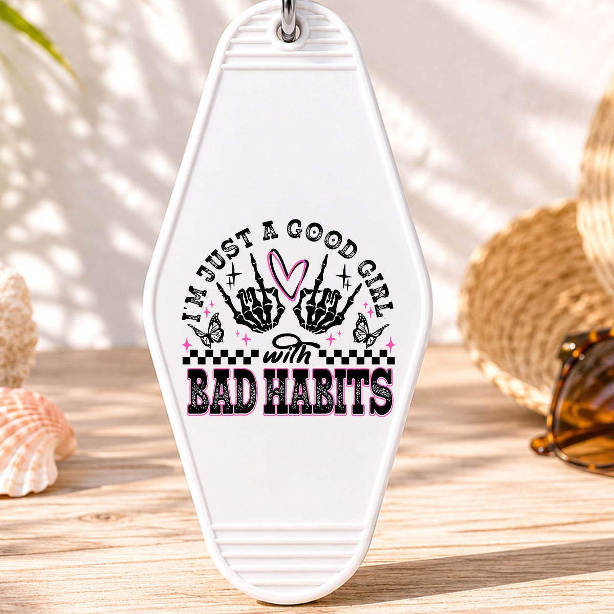 Just a Good Girl With Bad Habits UV DTF transfer on a white motel keychain with beach decor