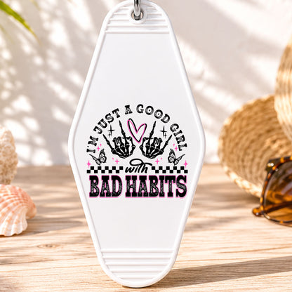 Just a Good Girl With Bad Habits UV DTF transfer on a white motel keychain with beach decor