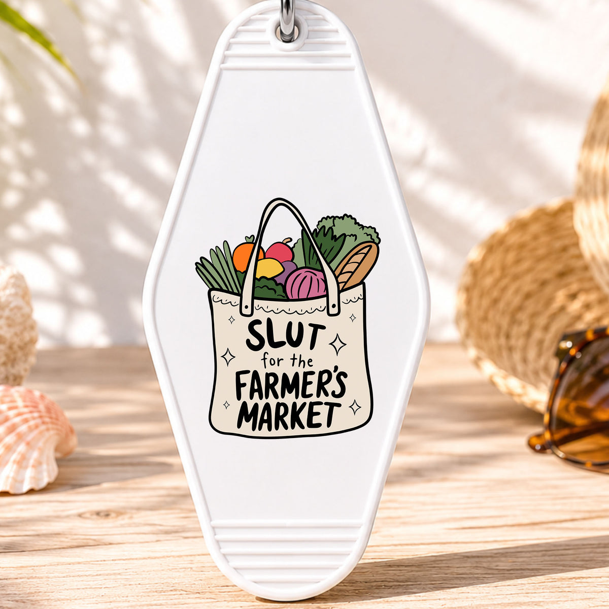 Sl*t for the Farmer's Market UV DTF transfer on a white motel keychain with beach decor