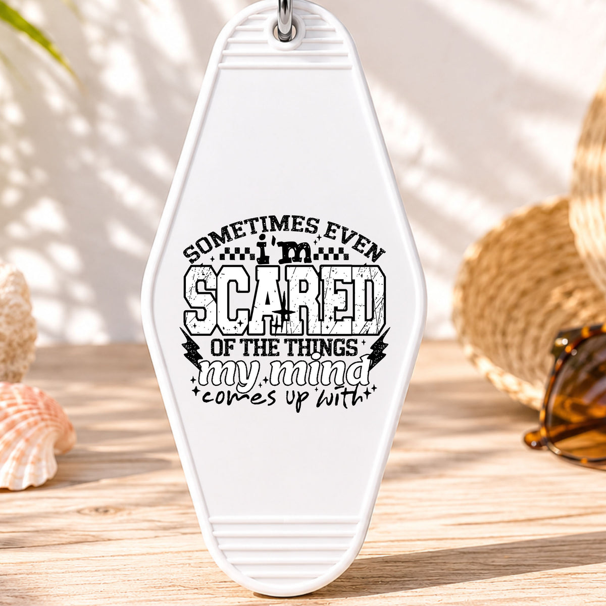 Sometimes Even I'm Scared UV DTF transfer on a white motel keychain with beach decor