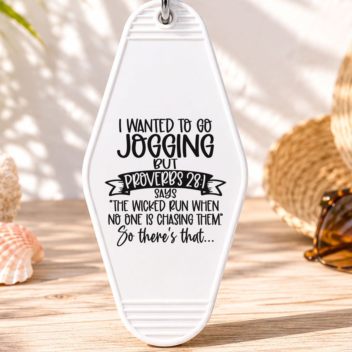 I Wanted to Go Jogging UV DTF transfer on a white motel keychain with beach decor