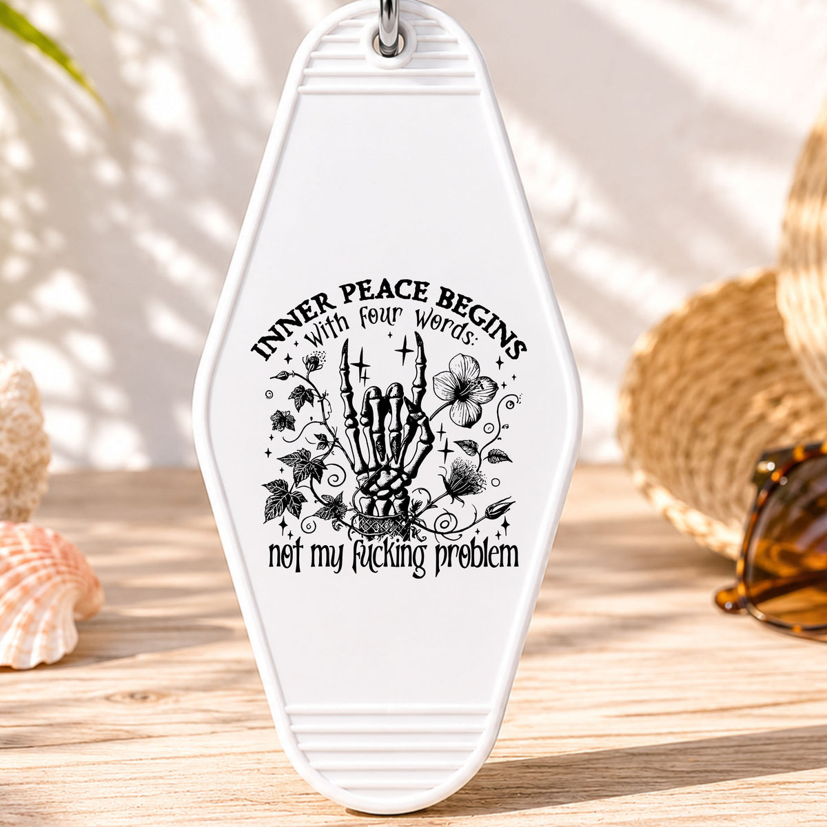 Inner Peace Begins With Four Words UV DTF transfer on a white motel keychain with beach decor