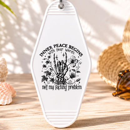 Inner Peace Begins With Four Words UV DTF transfer on a white motel keychain with beach decor