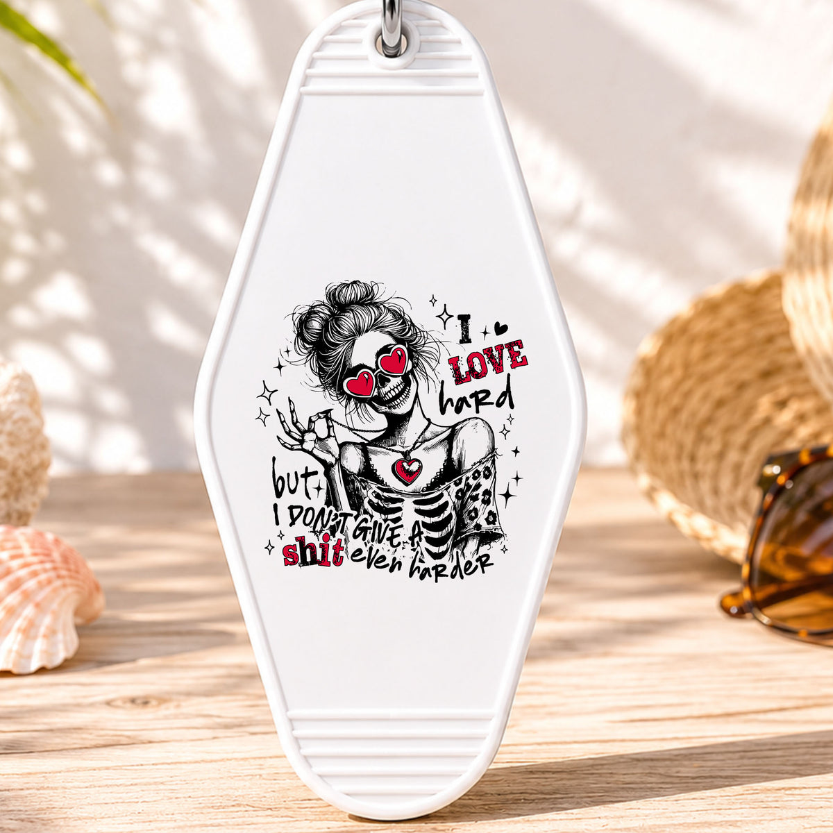I Love Hard UV DTF transfer on a white motel keychain with beach decor