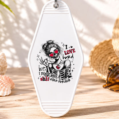 I Love Hard UV DTF transfer on a white motel keychain with beach decor