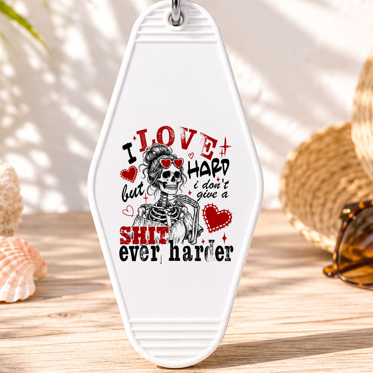 I Love Hard UV DTF transfer on a white motel keychain with beach decor