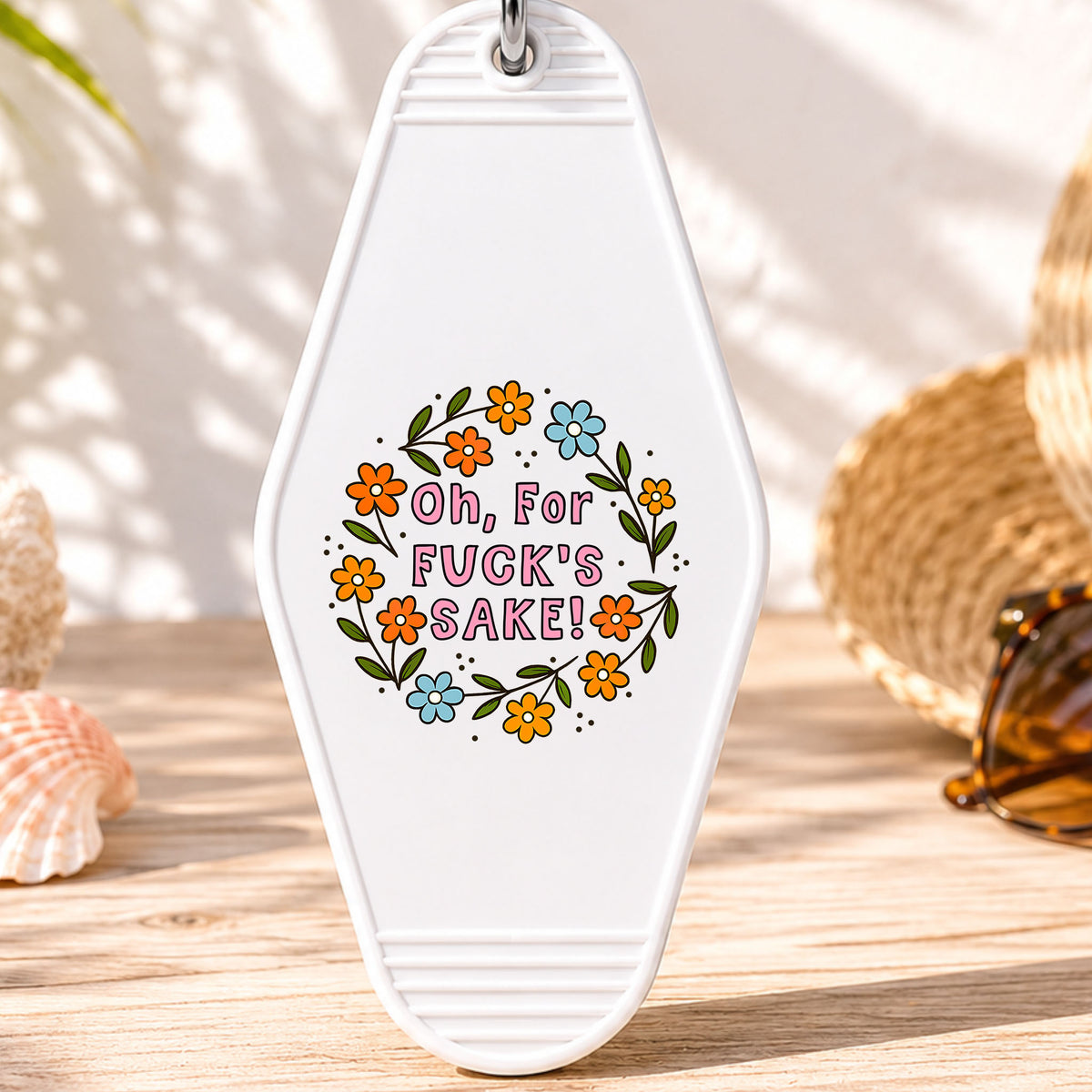 Oh for F*ck's Sake UV DTF transfer on a white motel keychain with beach decor