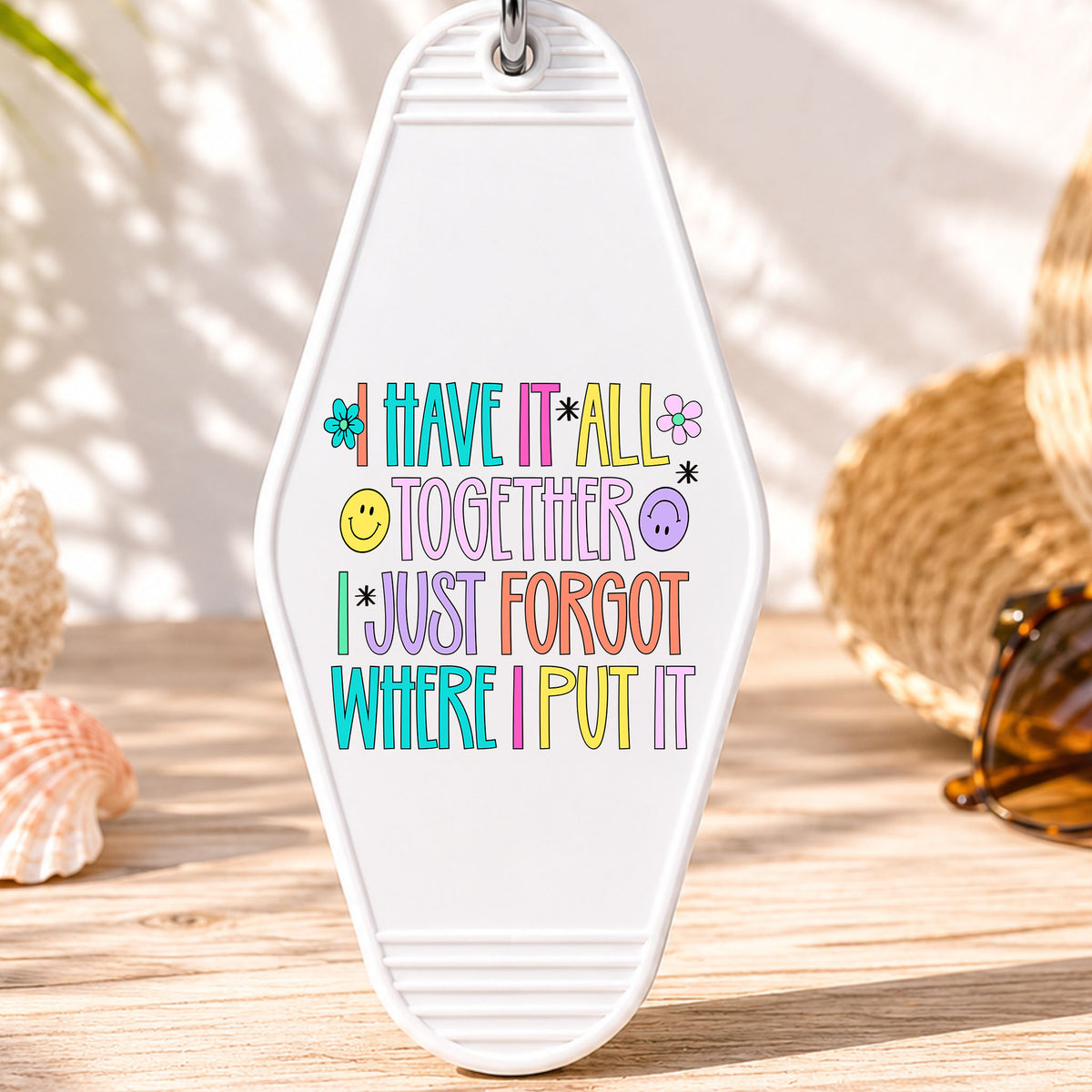 I Have It All Together I Just Forgot Where I Put It UV DTF transfer on a white motel keychain with beach decor