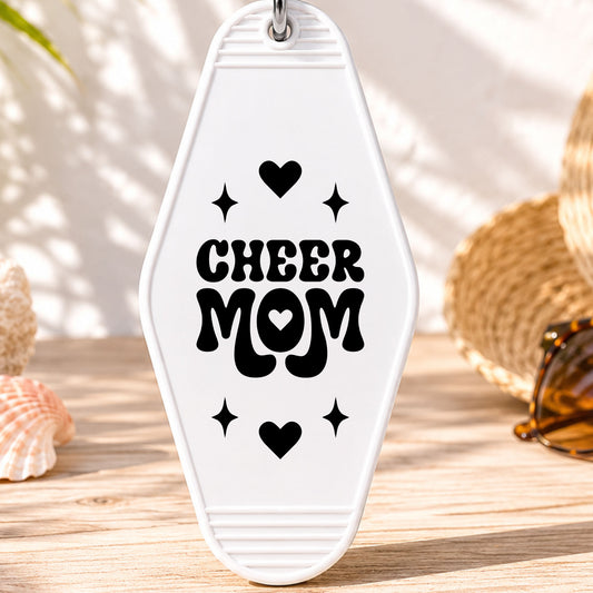 Cheer Mom UV DTF transfer on a white motel keychain with beach decor