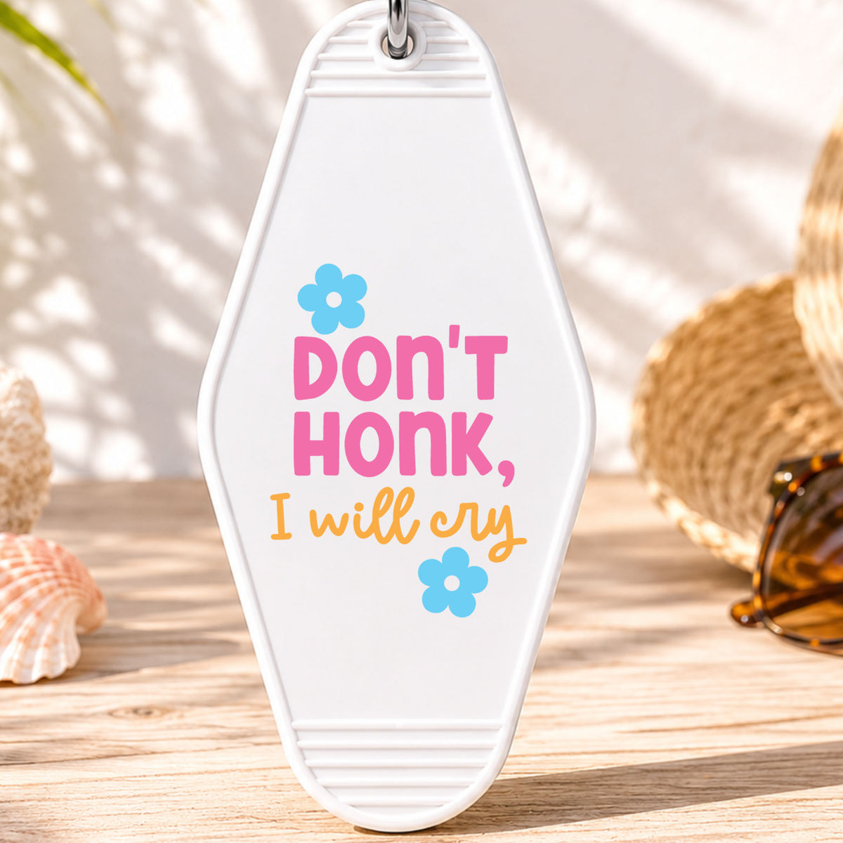 Don't Honk I Will Cry UV DTF transfer on a white motel keychain with beach decor