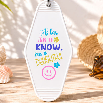 As Far as I Know I'm Delightful UV DTF transfer on a white motel keychain with beach decor