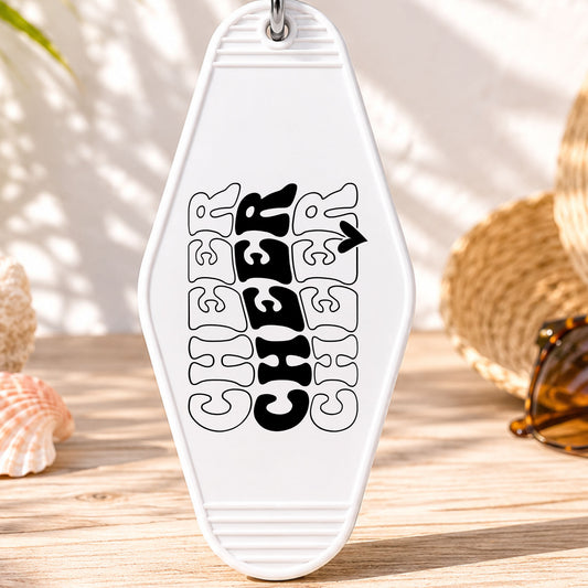 Cheer Cheer Cheer UV DTF transfer on a white motel keychain with beach decor