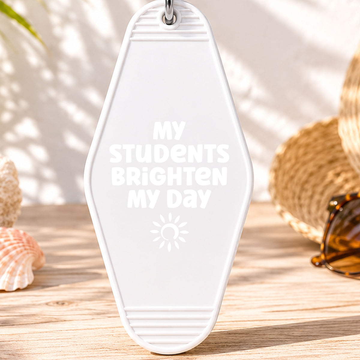 My Students Brighten My Day UV DTF transfer on a white motel keychain with beach decor
