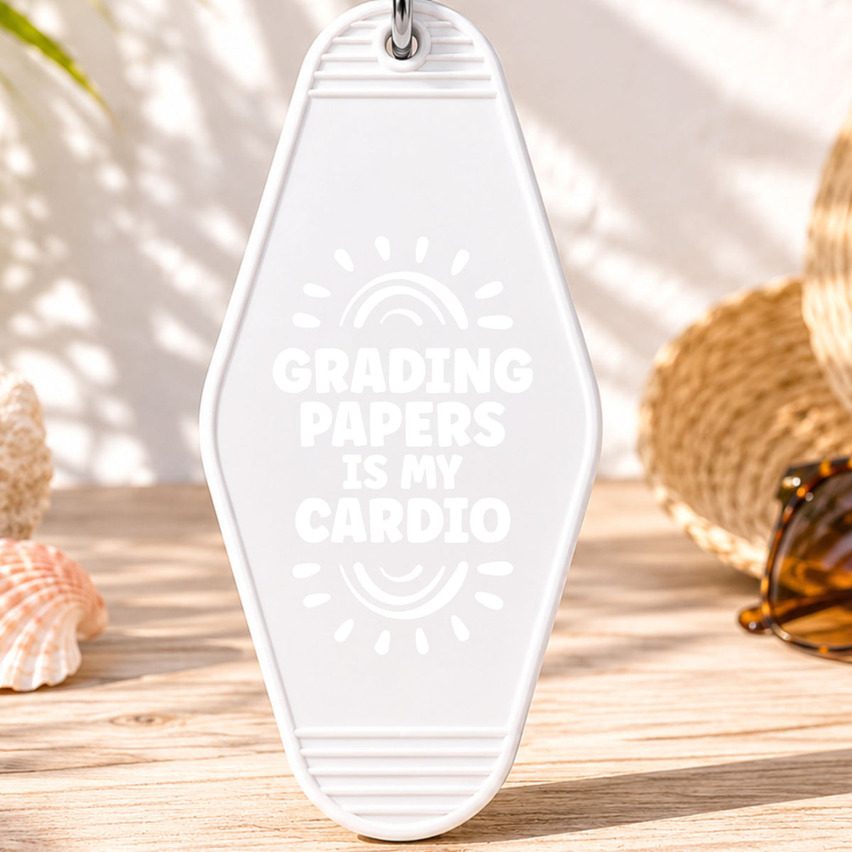Grading Papers Is My Cardio UV DTF transfer on a white motel keychain with beach decor