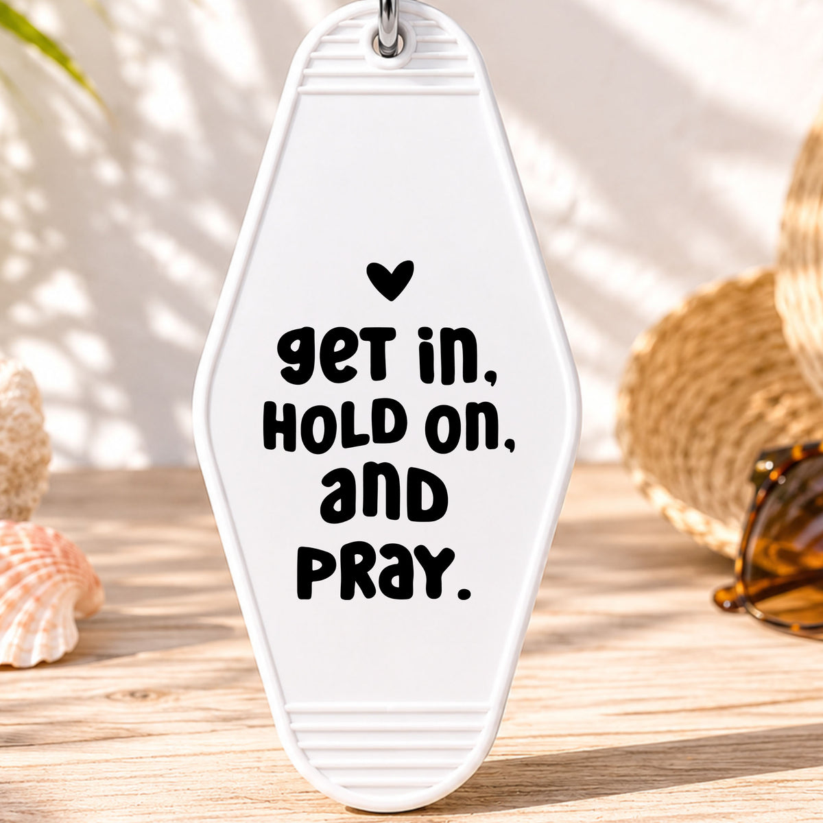 Get In Hold On and Pray UV DTF transfer on a white motel keychain with beach decor