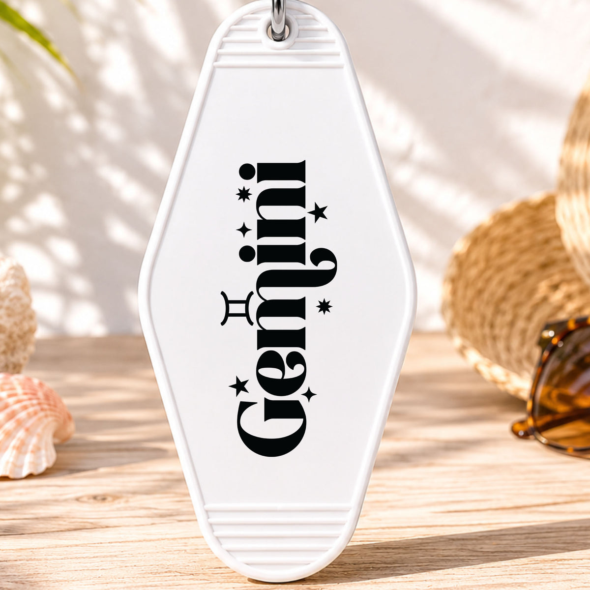 Gemini UV DTF transfer on a white motel keychain with beach decor