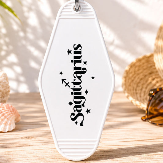 Sagittarius UV DTF transfer on a white motel keychain with beach decor