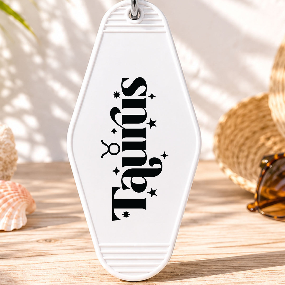 Taurus UV DTF transfer on a white motel keychain with beach decor