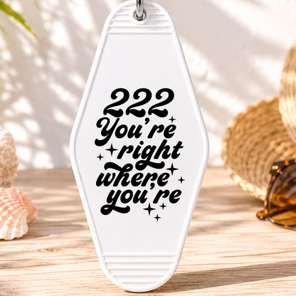 222 You're Right Where You're Meant to Be UV DTF transfer on a white motel keychain with beach decor