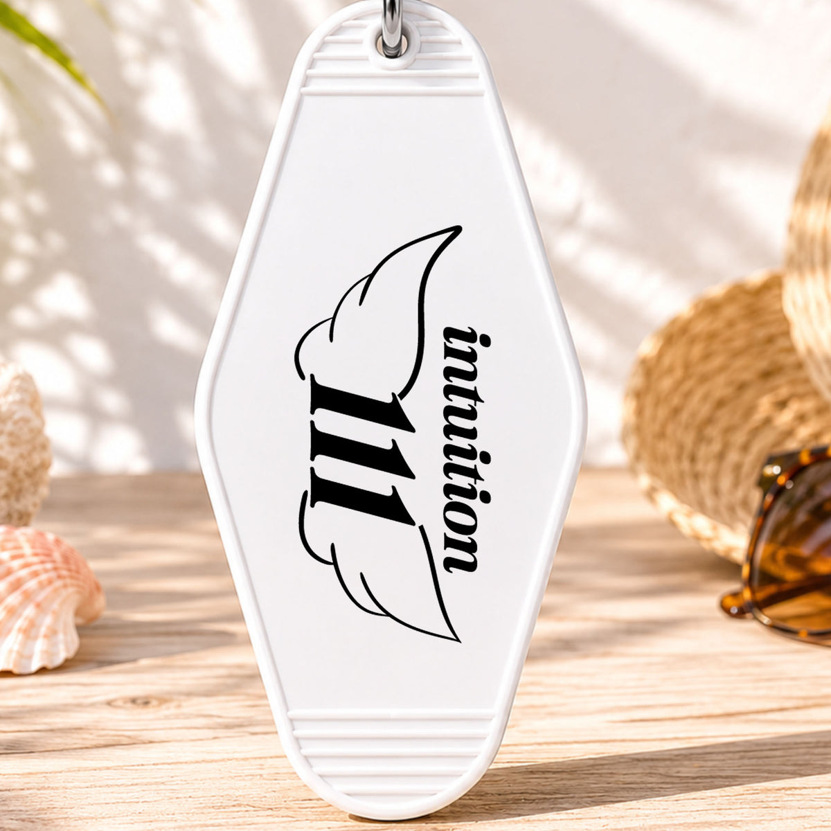 111 Intuition UV DTF transfer on a white motel keychain with beach decor
