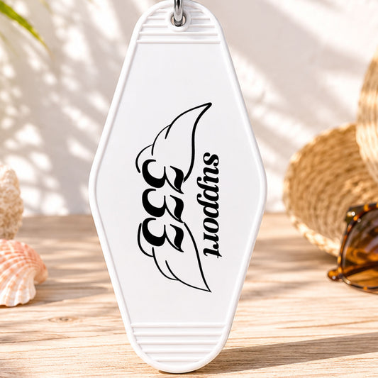 333 Support UV DTF transfer on a white motel keychain with beach decor