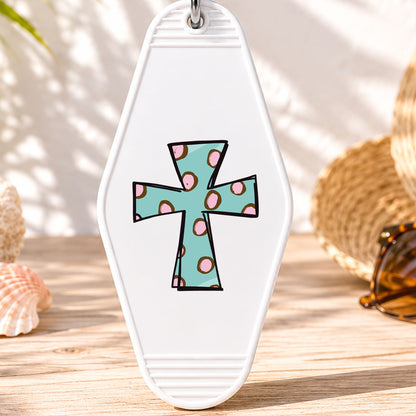Polka Dot Cross UV DTF transfer on a white motel keychain with beach decor