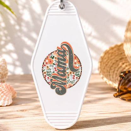 Mama UV DTF transfer on a white motel keychain with beach decor