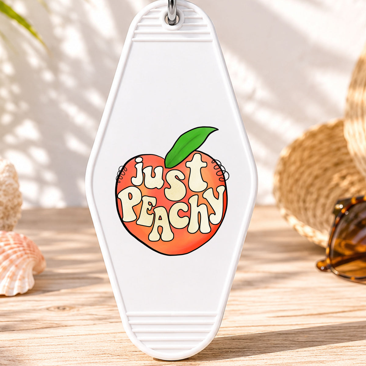 Just Peachy UV DTF transfer on a white motel keychain with beach decor
