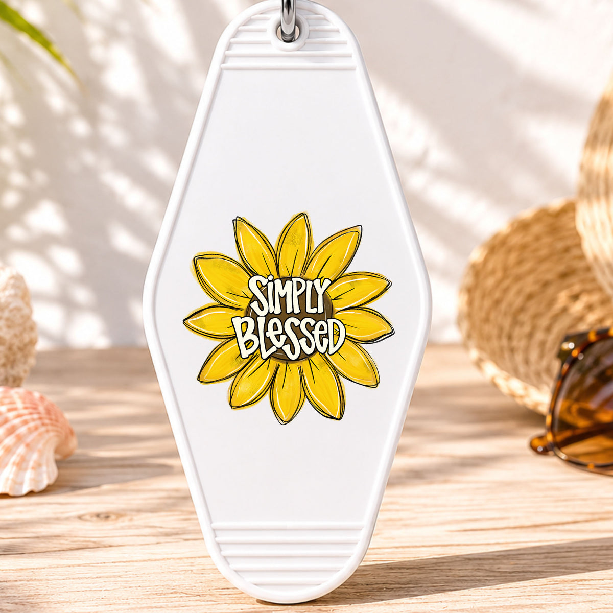 Simply Blessed UV DTF transfer on a white motel keychain with beach decor