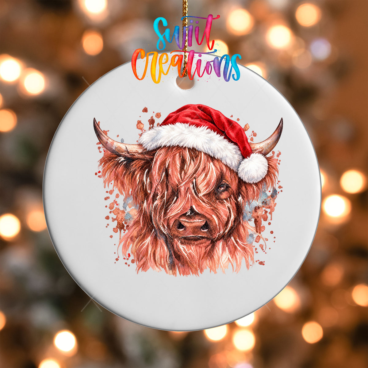 Close-up of the Highland Cow Santa Hat UV DTF transfer on a round white ornament