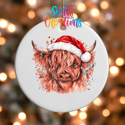 Close-up of the Highland Cow Santa Hat UV DTF transfer on a round white ornament