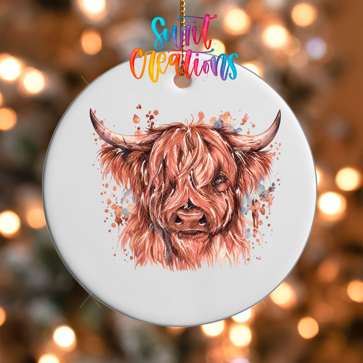 Close-up of the rose-toned Highland Cow UV DTF transfer on a round white ornament