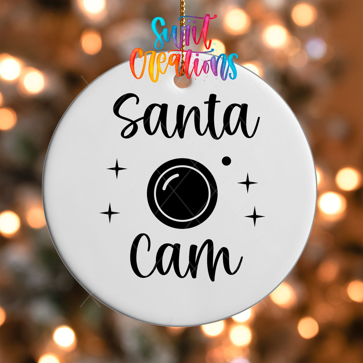 Close-up of the Santa Cam UV DTF transfer on a round white ornament