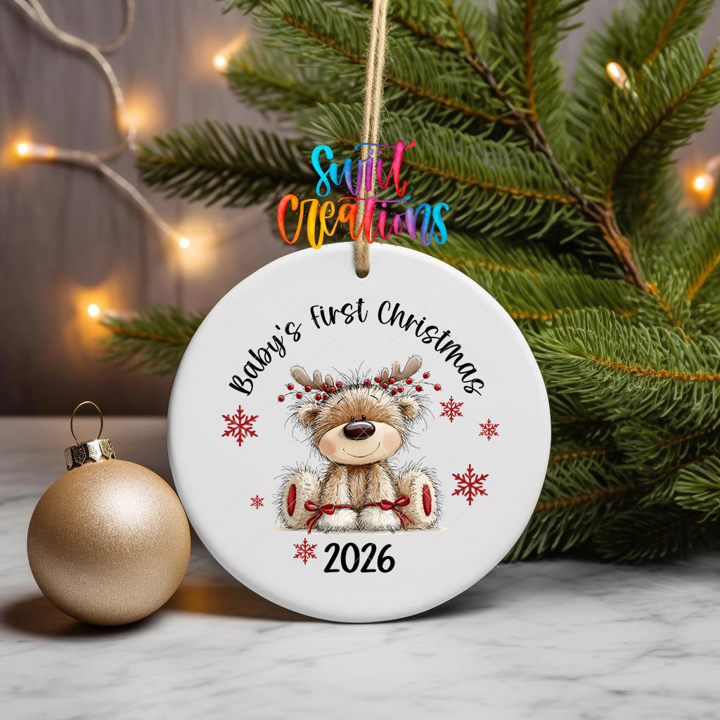 Baby's First Christmas ornament UV DTF transfer on a hanging ornament with pine branches and a gold bauble