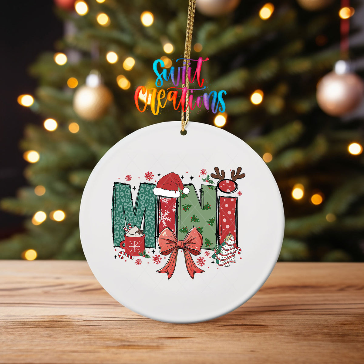 Mini ornament UV DTF transfer on an ornament on a wooden table with tree lights behind it