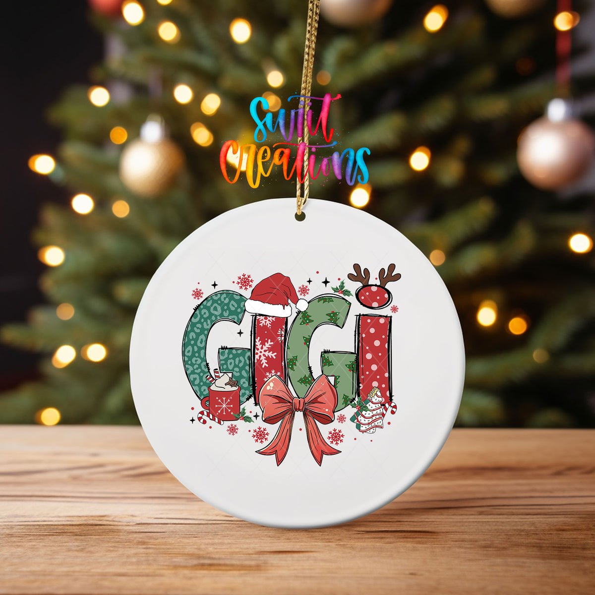 Gigi ornament UV DTF transfer on an ornament on a wooden table with tree lights behind it