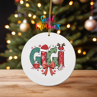 Gigi ornament UV DTF transfer on an ornament on a wooden table with tree lights behind it